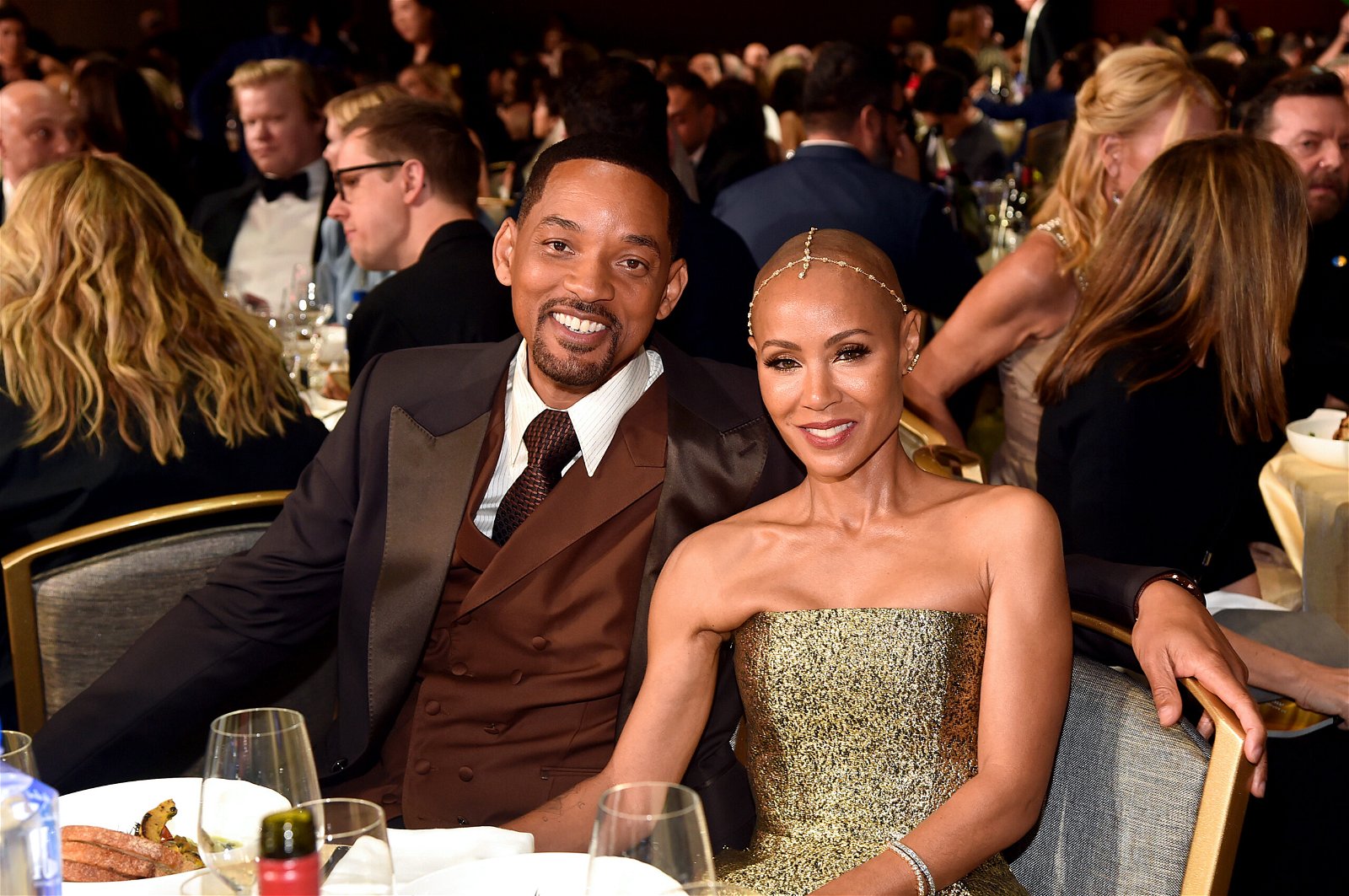 Will Smith and Jada Pinkett Smith join hands with Williams sisters.